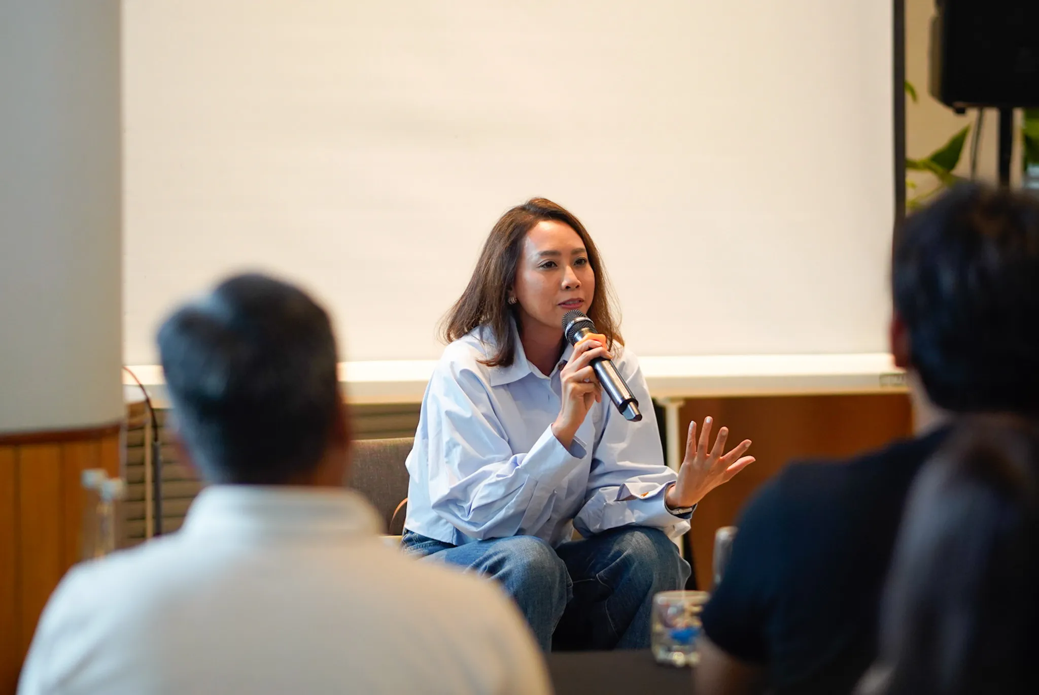 Founders in discussion during a SEED Inclusivity bootcamp session, leaning over their work together
