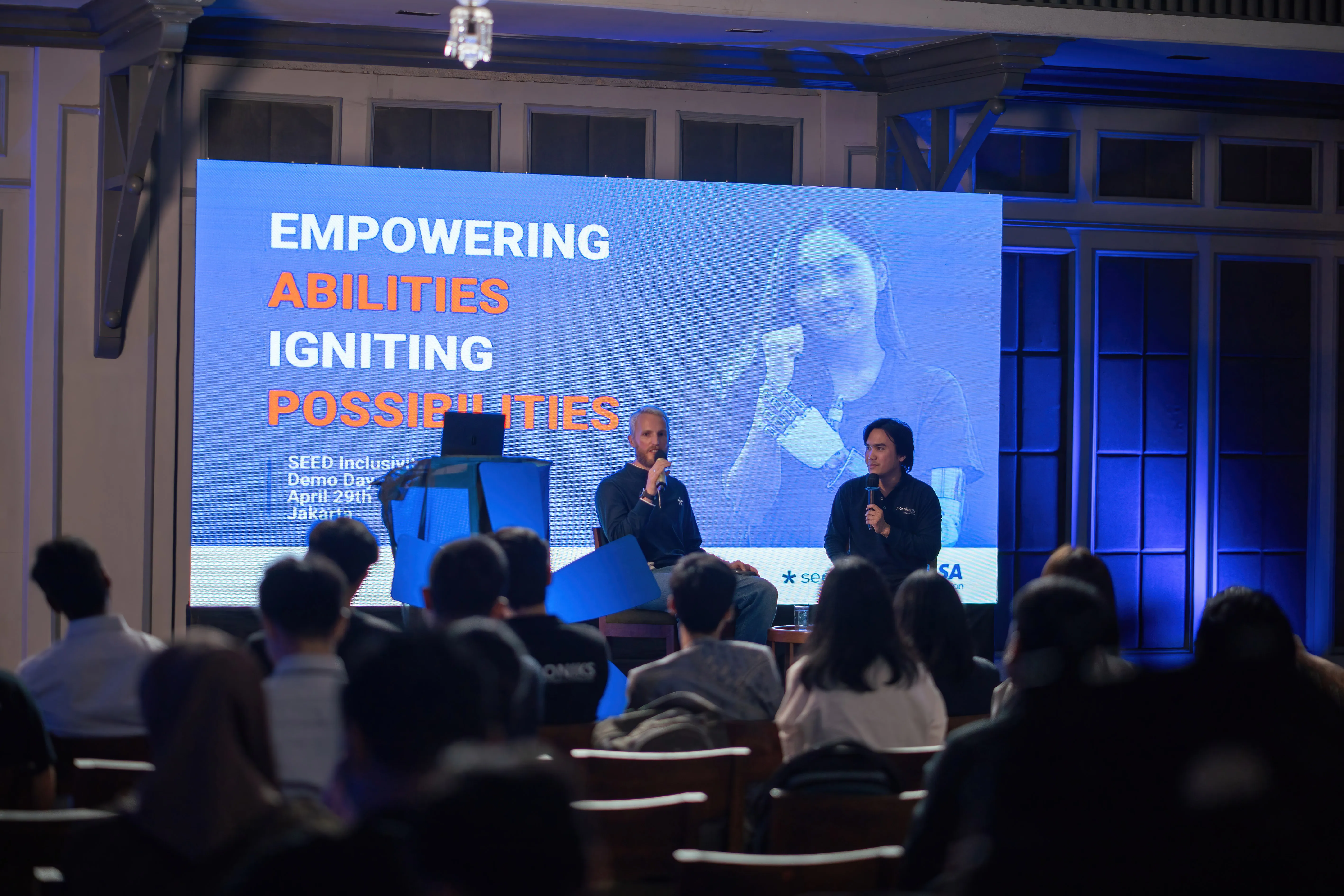 A fireside chat at the Jakarta Demo Day: speakers in conversation in front of a seated audience