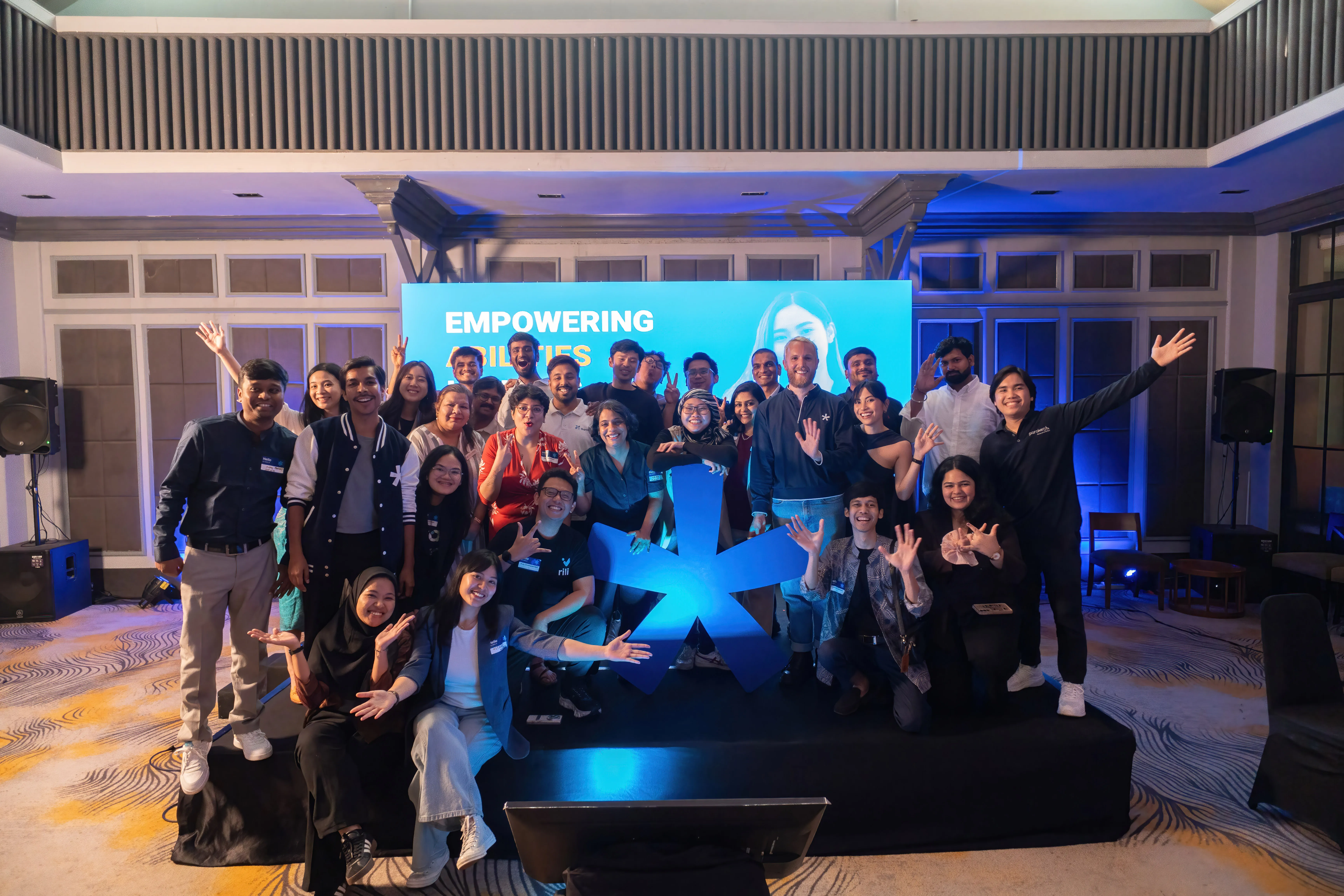 Cohort 2 founders, coaches, and the Seedstars team gathered on stage at Demo Day in Jakarta, smiling and applauding